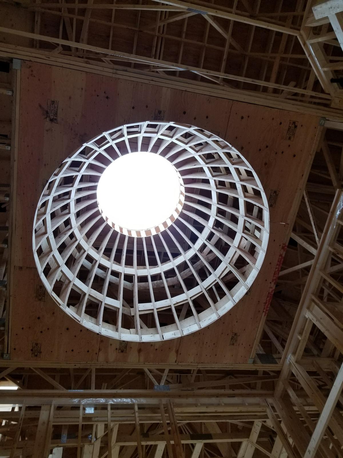 Circular domed ceiling framing with a round skylight opening