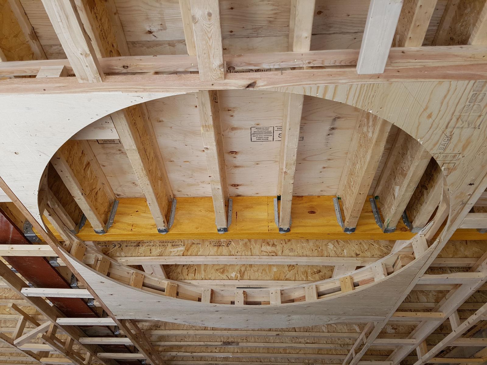 Elliptical ceiling opening framed with engineered joists